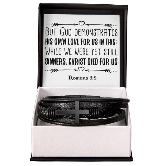 But God demonstrates his own love for us in this While we were yet still sinners, Christ died for us RVRNT Men's Cross Bracelet