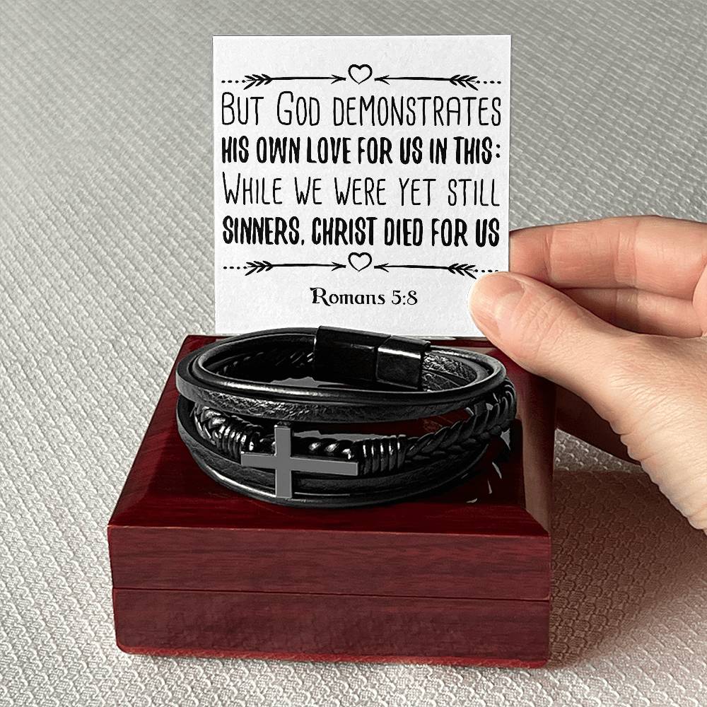 But God demonstrates his own love for us in this While we were yet still sinners, Christ died for us RVRNT Men's Cross Bracelet